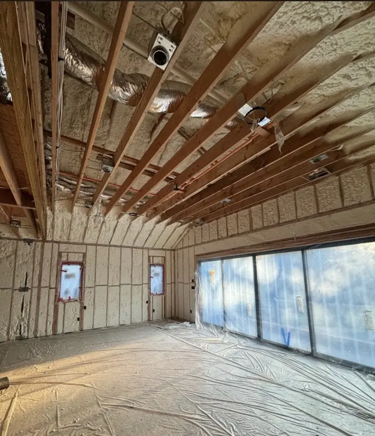 Interior walls and ceiling insulated with spray foam during new construction in Melissa